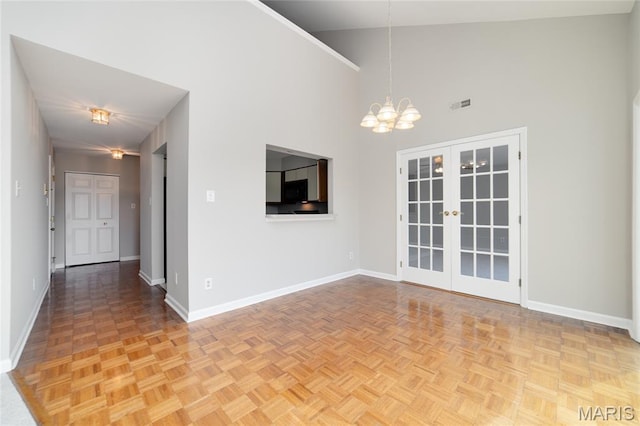 1632 Lake Knoll Dr Unit 1P, Lake St Louis, MO 63367 - spare room with a chandelier, a towering ceiling, and french doors