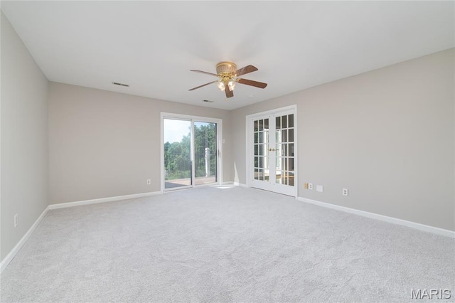 1632 Lake Knoll Dr Unit 1P, Lake St Louis, MO 63367 - unfurnished room with ceiling fan, french doors, and carpet