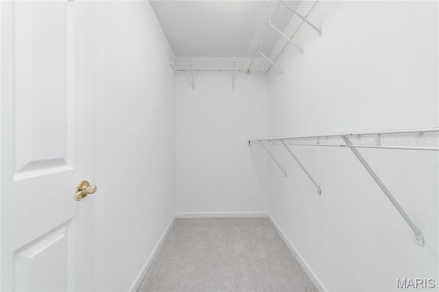 1632 Lake Knoll Dr Unit 1P, Lake St Louis, MO 63367 - walk in closet with light carpet