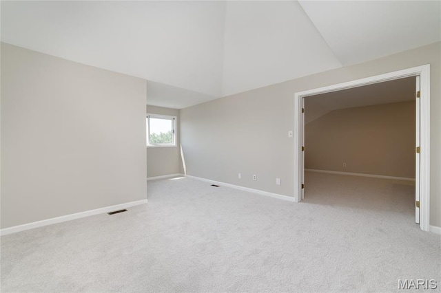 1632 Lake Knoll Dr Unit 1P, Lake St Louis, MO 63367 - carpeted empty room with vaulted ceiling and baseboards