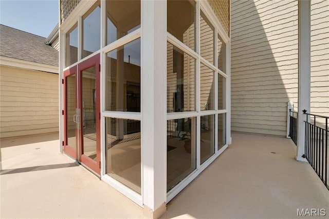 1632 Lake Knoll Dr Unit 1P, Lake St Louis, MO 63367 - view of exterior entry with roof with shingles