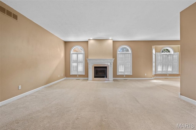 1805 Lincoln Knolls Dr, Edwardsville, IL 62025 - unfurnished living room featuring carpet and a fireplace with flush hearth