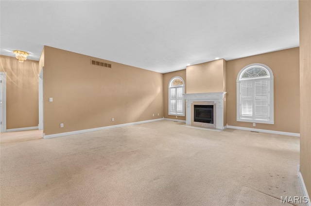 1805 Lincoln Knolls Dr, Edwardsville, IL 62025 - unfurnished living room with carpet floors and a fireplace with flush hearth