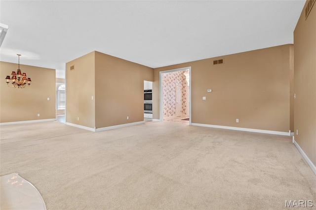 1805 Lincoln Knolls Dr, Edwardsville, IL 62025 - spare room with a chandelier and light carpet