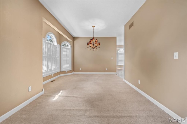 1805 Lincoln Knolls Dr, Edwardsville, IL 62025 - carpeted empty room featuring a chandelier and plenty of natural light