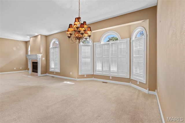 1805 Lincoln Knolls Dr, Edwardsville, IL 62025 - unfurnished living room featuring carpet, a chandelier, and a high end fireplace