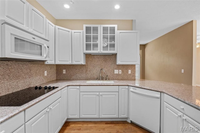 1805 Lincoln Knolls Dr, Edwardsville, IL 62025 - kitchen with white appliances, white cabinets, glass insert cabinets, and recessed lighting