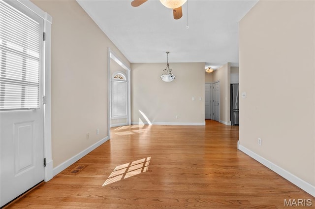 1805 Lincoln Knolls Dr, Edwardsville, IL 62025 - unfurnished living room featuring ceiling fan and light wood-style floors