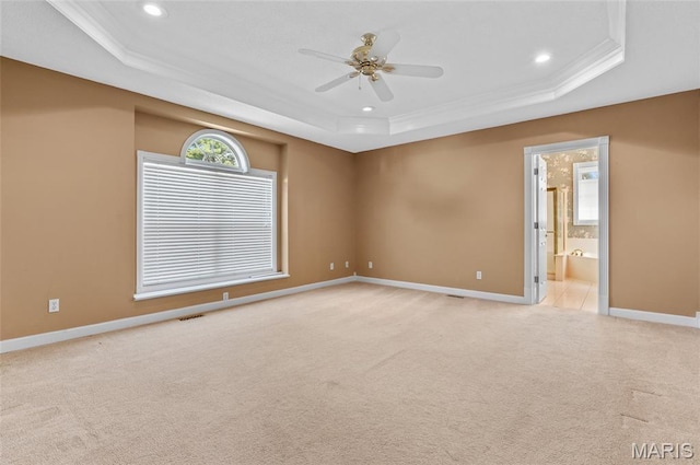 1805 Lincoln Knolls Dr, Edwardsville, IL 62025 - empty room featuring a tray ceiling, ceiling fan, recessed lighting, ornamental molding, and light carpet