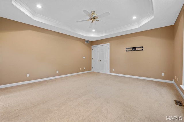 1805 Lincoln Knolls Dr, Edwardsville, IL 62025 - spare room featuring a raised ceiling, ornamental molding, a ceiling fan, light colored carpet, and recessed lighting