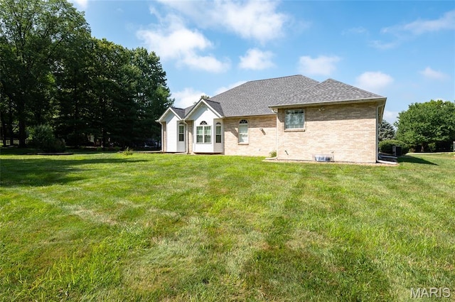 1805 Lincoln Knolls Dr, Edwardsville, IL 62025 - rear view of property featuring a lawn, brick siding, and a shingled roof