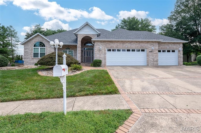 1805 Lincoln Knolls Dr, Edwardsville, IL 62025 - single story home with a front lawn, a garage, driveway, roof with shingles, and brick siding