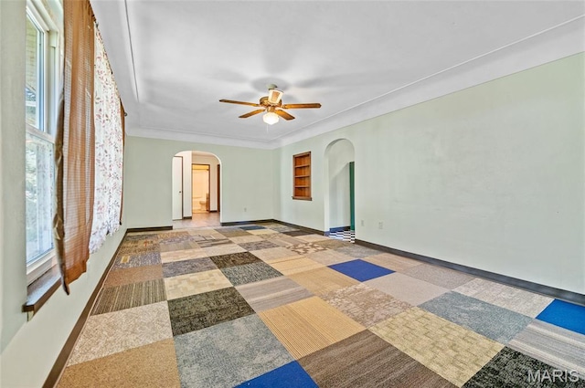 2 Willow Dr, Fairview Heights, IL 62208 - empty room featuring arched walkways and a ceiling fan