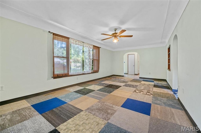 2 Willow Dr, Fairview Heights, IL 62208 - empty room with arched walkways, ceiling fan, and carpet flooring