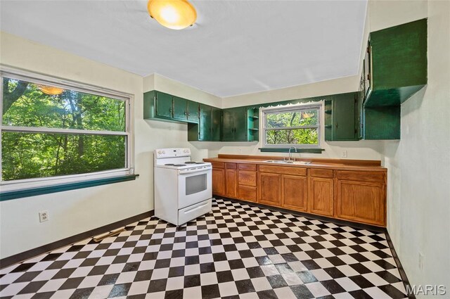 2 Willow Dr, Fairview Heights, IL 62208 - kitchen with electric range, tile patterned floors, and open shelves