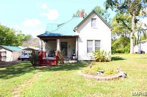805 N Carleton, Farmington, MO 63640 - rear view of property with a lawn, covered porch, and a carport