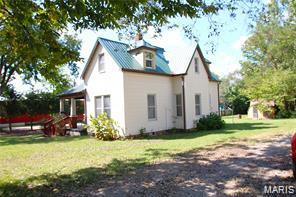 805 N Carleton, Farmington, MO 63640 - view of home's exterior with a lawn and a metal roof