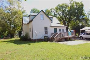 805 N Carleton, Farmington, MO 63640 - back of house featuring a deck, a yard, and a metal roof
