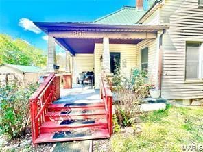 805 N Carleton, Farmington, MO 63640 - rear view of property featuring a porch and a chimney