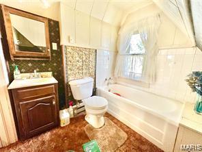 805 N Carleton, Farmington, MO 63640 - full bathroom with a garden tub, vanity, and lofted ceiling