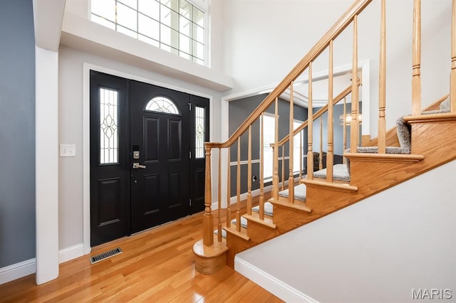 804 Cardiff Ct, Ofallon, IL 62269 - foyer with wood finished floors, stairway, and a high ceiling