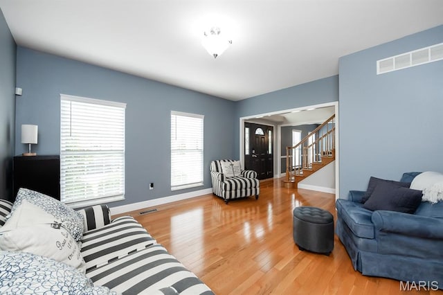 804 Cardiff Ct, Ofallon, IL 62269 - living area featuring stairway and light wood finished floors