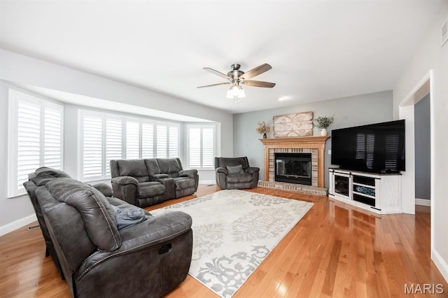 804 Cardiff Ct, Ofallon, IL 62269 - living area featuring ceiling fan, wood finished floors, and a fireplace