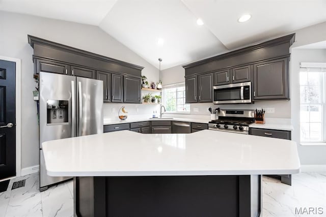 804 Cardiff Ct, Ofallon, IL 62269 - kitchen featuring appliances with stainless steel finishes, light marble finish flooring, vaulted ceiling, light countertops, and open shelves