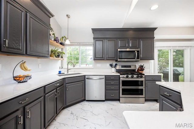 804 Cardiff Ct, Ofallon, IL 62269 - kitchen featuring appliances with stainless steel finishes, healthy amount of natural light, light marble finish flooring, and recessed lighting