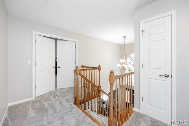 804 Cardiff Ct, Ofallon, IL 62269 - hallway featuring an upstairs landing, carpet flooring, and a chandelier