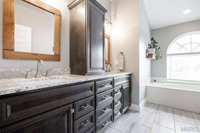 804 Cardiff Ct, Ofallon, IL 62269 - bathroom featuring double vanity and a garden tub