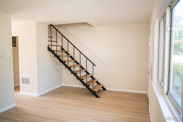 7346 Hazelcrest Dr, Hazelwood, MO 63042 - stairway featuring wood finished floors and baseboards