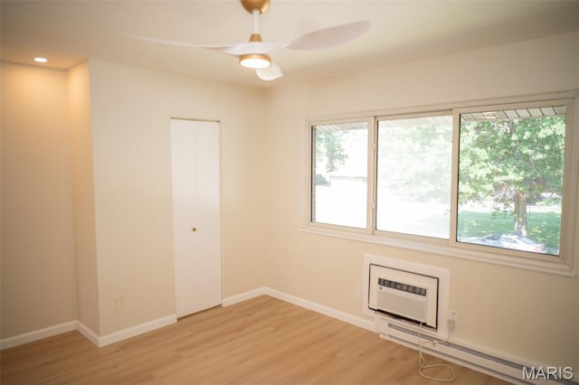 7346 Hazelcrest Dr, Hazelwood, MO 63042 - spare room with light wood-style flooring, a ceiling fan, a wall mounted AC, baseboard heating, and recessed lighting