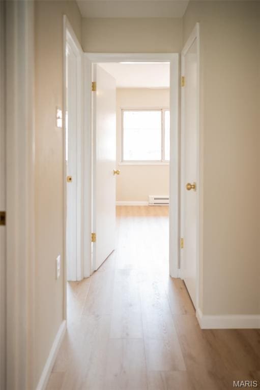 7346 Hazelcrest Dr, Hazelwood, MO 63042 - corridor featuring baseboard heating and baseboards
