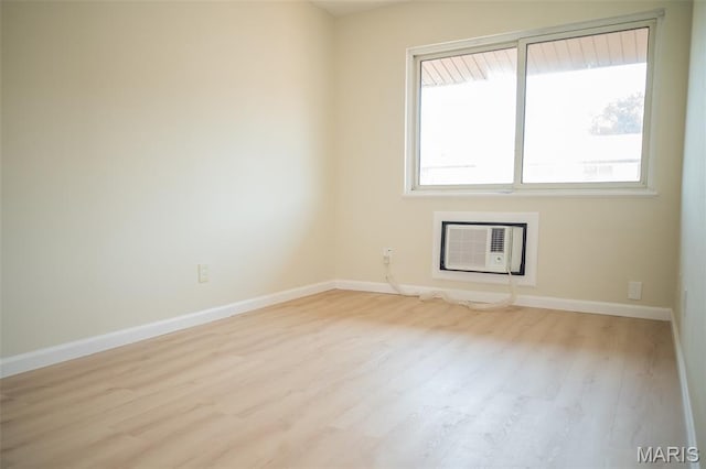 7346 Hazelcrest Dr, Hazelwood, MO 63042 - unfurnished room featuring wood finished floors and a wall mounted AC