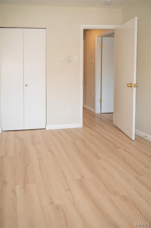 7346 Hazelcrest Dr, Hazelwood, MO 63042 - unfurnished bedroom with light wood-type flooring and a closet