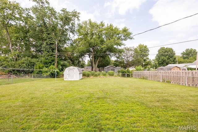 508 Joy Dr, Ofallon, IL 62269 - fenced backyard featuring a storage shed