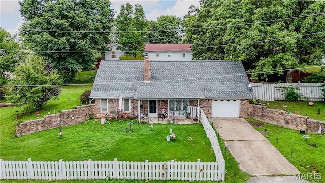 106 Red Bud Cir, Saint Robert, MO 65584 - view of front facade featuring a fenced front yard, a chimney, covered porch, driveway, and roof with shingles