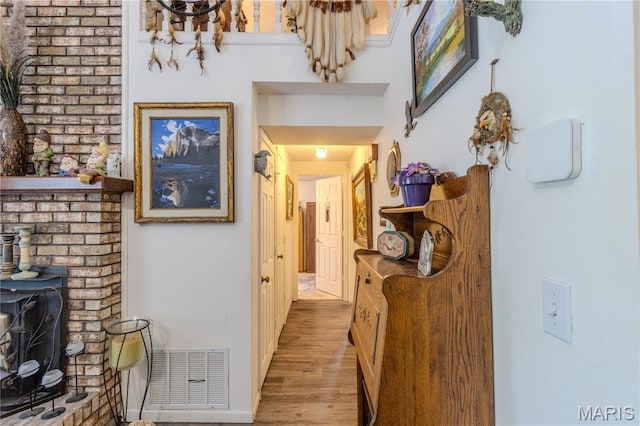 106 Red Bud Cir, Saint Robert, MO 65584 - corridor with wood finished floors