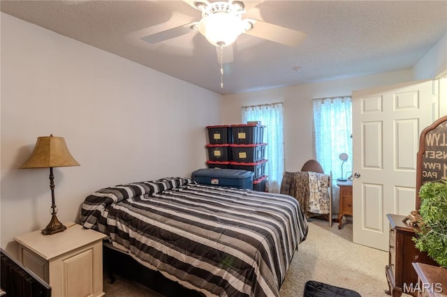 106 Red Bud Cir, Saint Robert, MO 65584 - bedroom featuring light carpet, a ceiling fan, and a textured ceiling