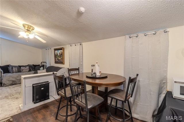 106 Red Bud Cir, Saint Robert, MO 65584 - dining space with a ceiling fan, a textured ceiling, and dark wood-type flooring