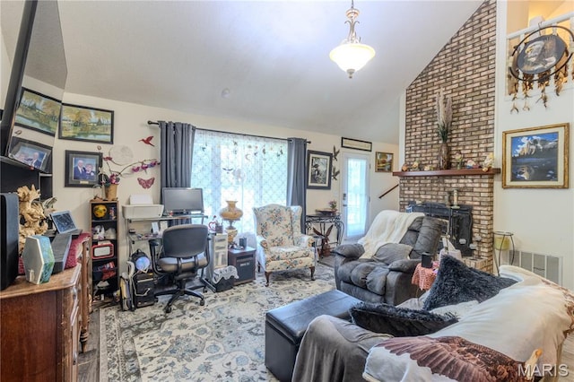 106 Red Bud Cir, Saint Robert, MO 65584 - living area featuring a desk, a brick fireplace, and high vaulted ceiling