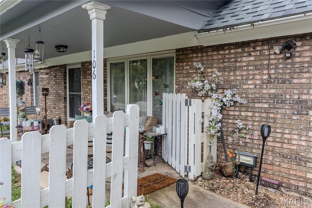 106 Red Bud Cir, Saint Robert, MO 65584 - entrance to property with roof with shingles and brick siding