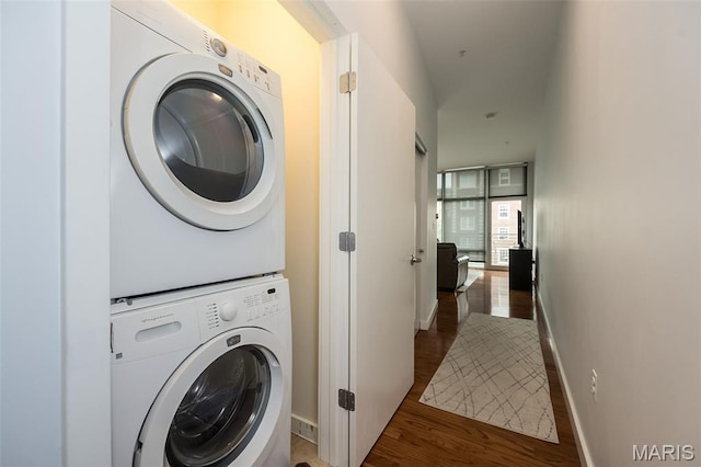 9 N Euclid Ave Unit 509, Saint Louis, MO 63108 - laundry room featuring stacked washer / drying machine and wood finished floors