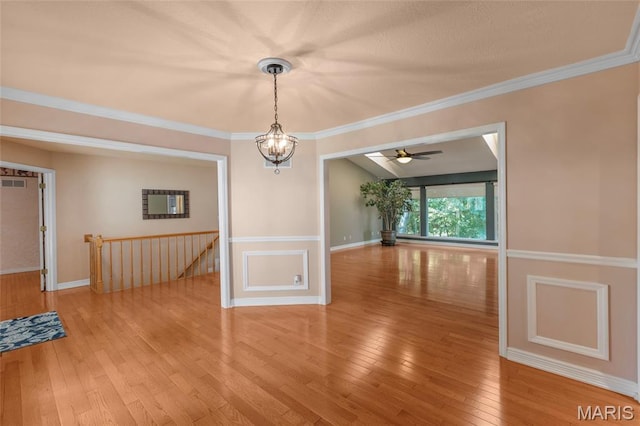 2028 During Dr, Arnold, MO 63010 - unfurnished dining area with wood-type flooring, a chandelier, ceiling fan, and ornamental molding