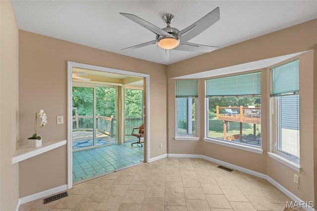 2028 During Dr, Arnold, MO 63010 - unfurnished room with plenty of natural light, a ceiling fan, and light tile patterned flooring