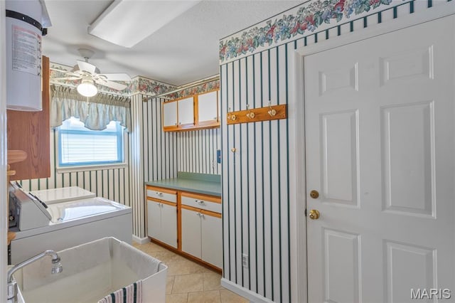 2028 During Dr, Arnold, MO 63010 - laundry area featuring washing machine and dryer, a ceiling fan, light tile patterned floors, and wallpapered walls