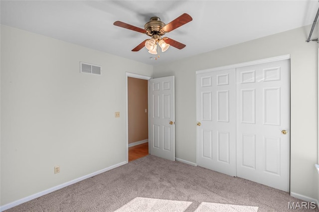 2028 During Dr, Arnold, MO 63010 - unfurnished bedroom with carpet, a closet, and a ceiling fan