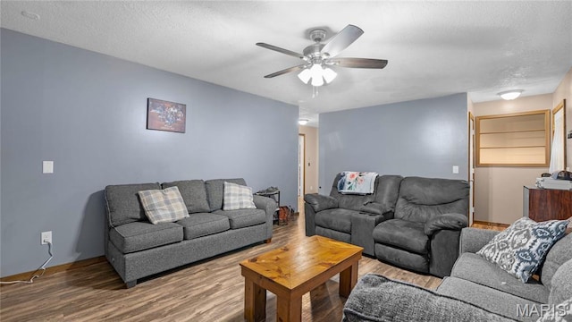 19954 Ironwood Ln, Lebanon, MO 65536 - living room with a ceiling fan, wood finished floors, and a textured ceiling