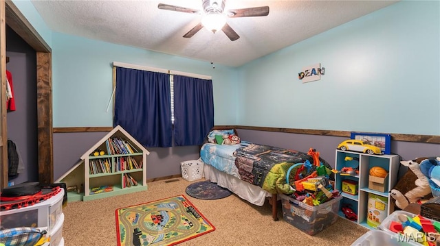 19954 Ironwood Ln, Lebanon, MO 65536 - carpeted bedroom with a textured ceiling and ceiling fan